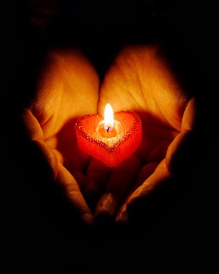 Heart Shaped Tea Light in Hands