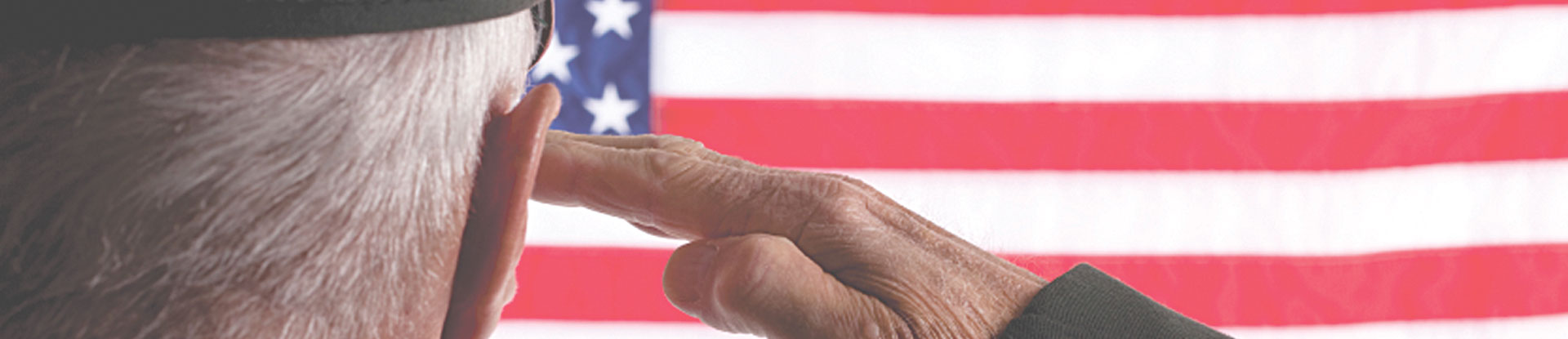 soldier saluting American flag
