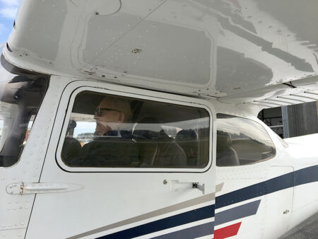closeup of plane with pilot inside cockpit