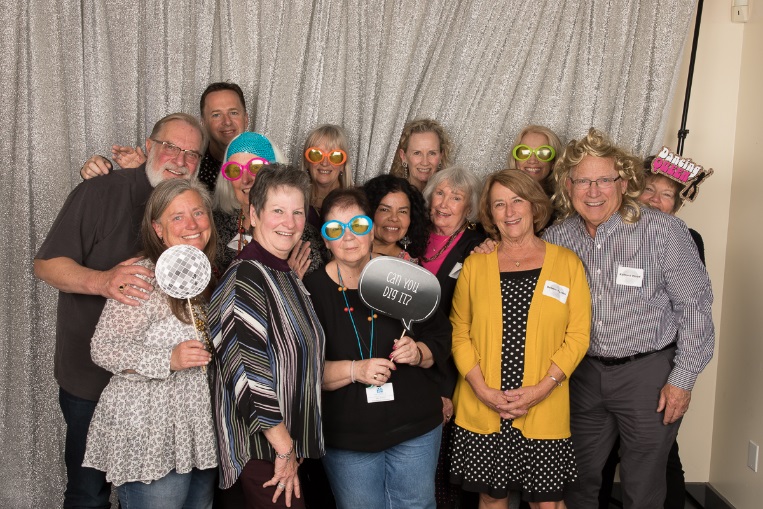 group of people wearing and holding props