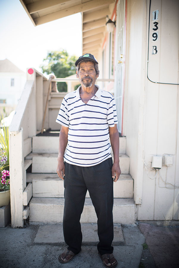 person standing in front of their house