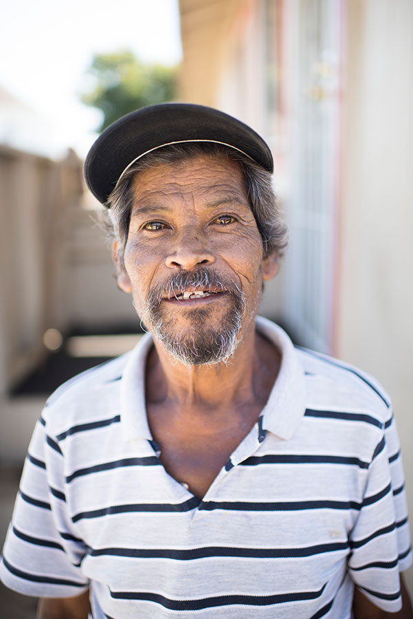 closeup of person standing in front of their house