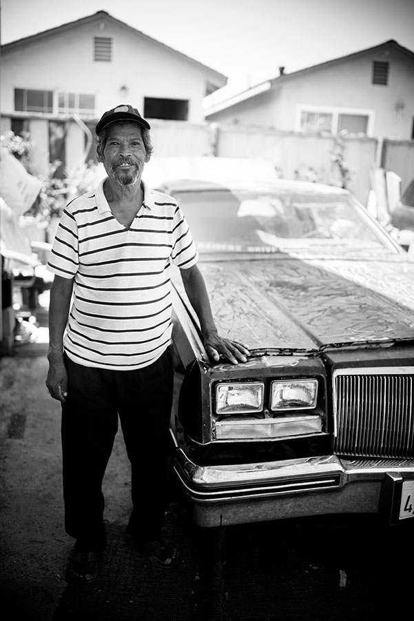 person standing in front of their classic car