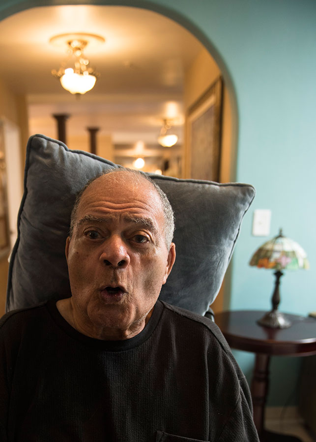 person sitting with pillow behind their head