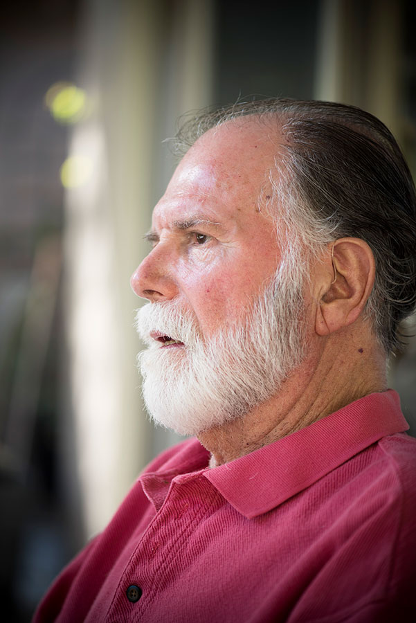closeup of person sitting outside their house