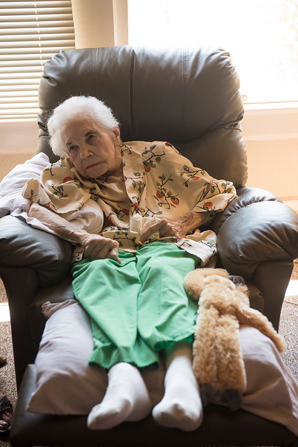 elderly person sitting in chair