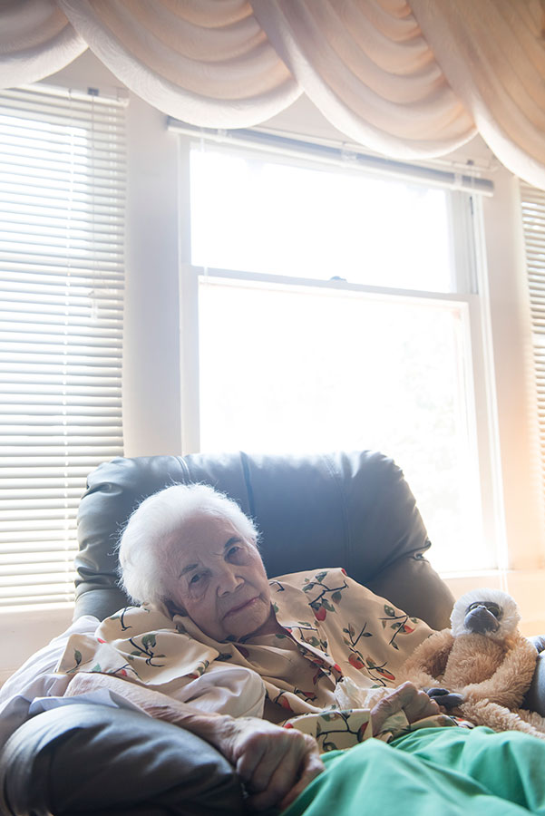 elderly person sitting in chair