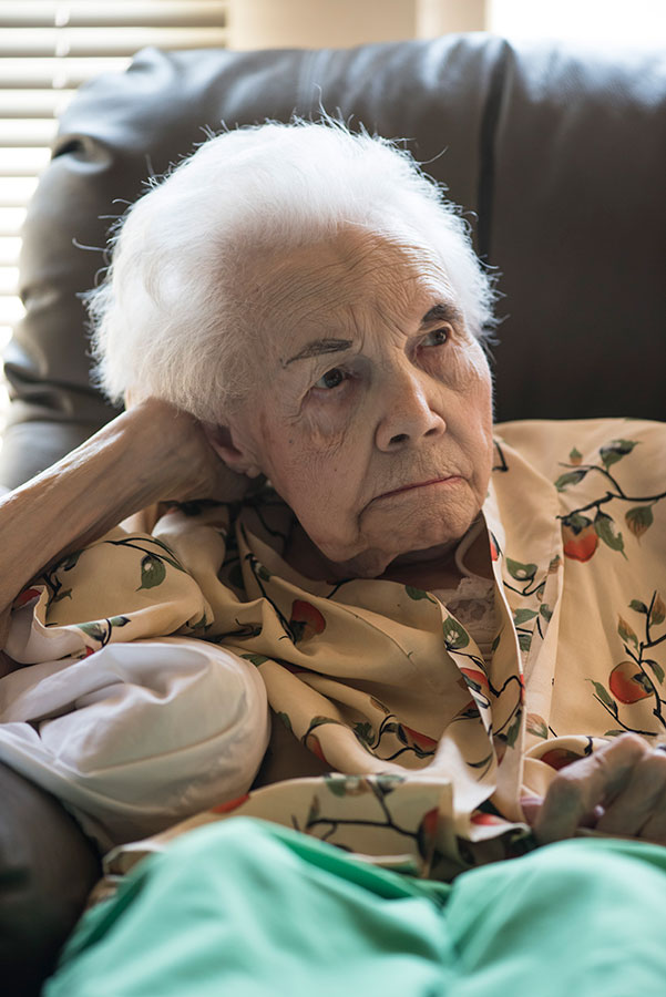 elderly person sitting in chair