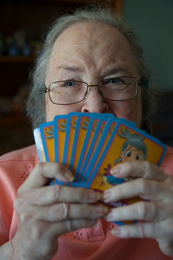 closeup of person holding playing cards