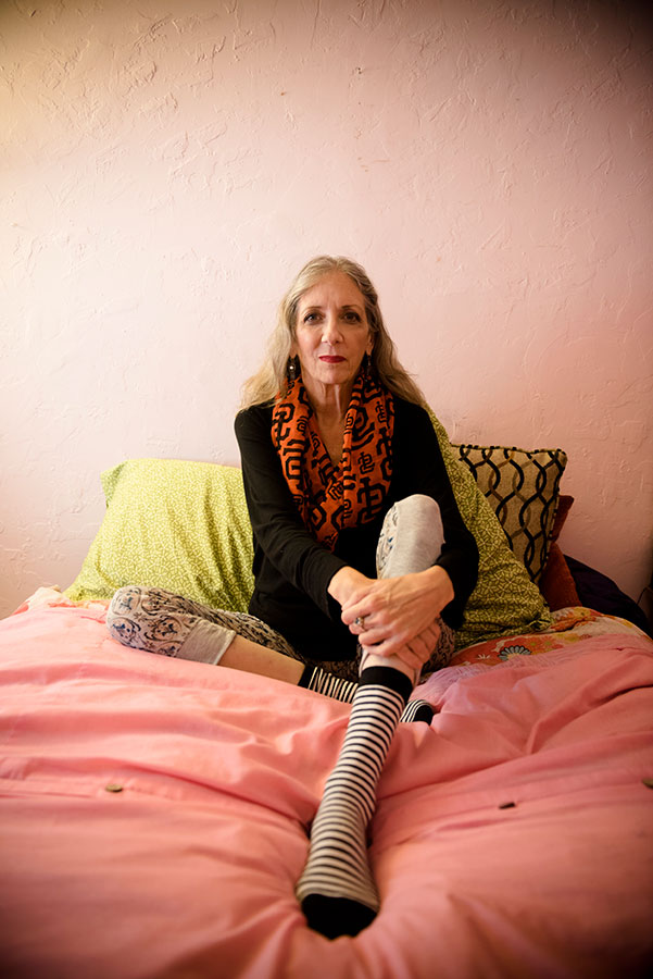 person sitting on a bed